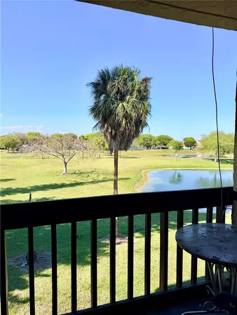 a view of a lake with houses in the back