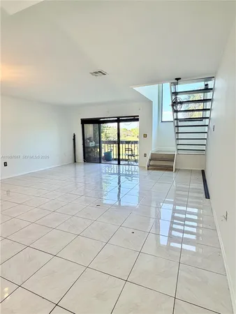 a view of empty room with windows