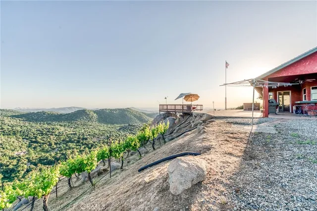 a house view with a yard and garage