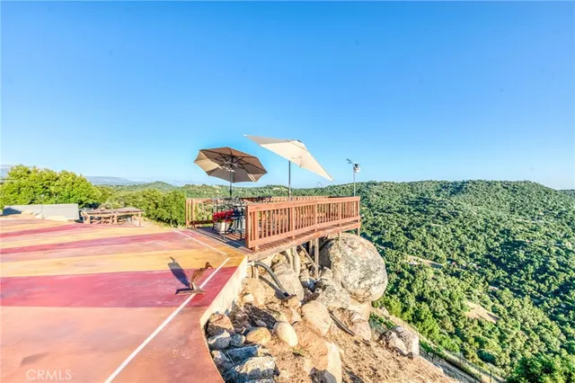a backyard of a house with yard and outdoor seating
