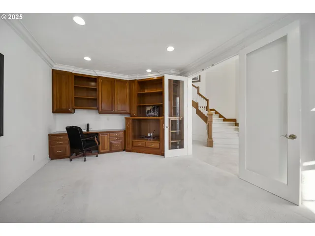 a view of a livingroom with furniture and an empty room