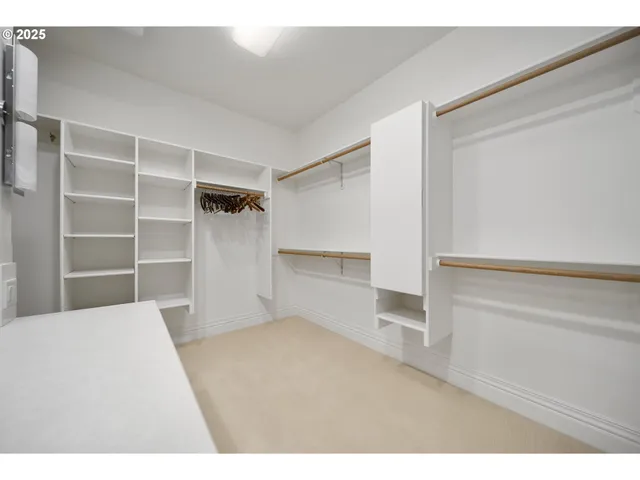 a bedroom with a bed and a walk in closet