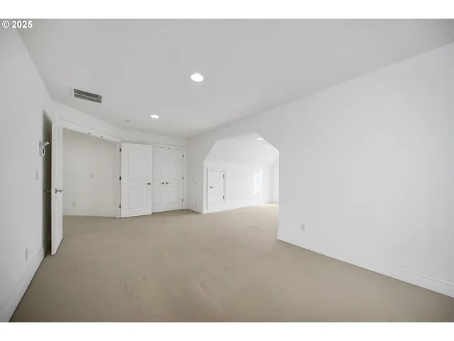 a view of empty room with windows