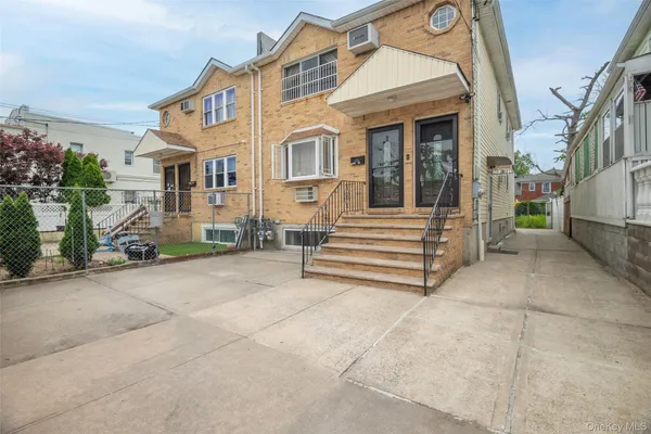 a view of a house with a street