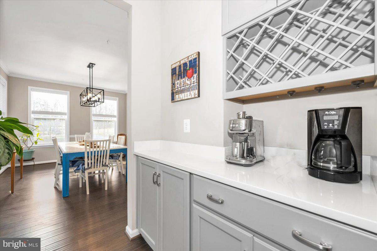 7796 Old Receiver Road Frederick, MD 21702 - Photo 12 of 65 a kitchen with a table chairs and wooden floor