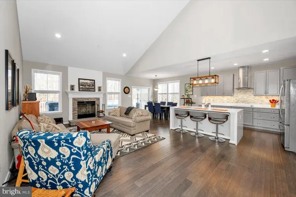 a view of a livingroom with furniture and a wooden floor