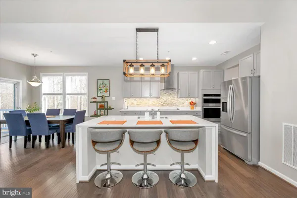 a view of a kitchen and dining room