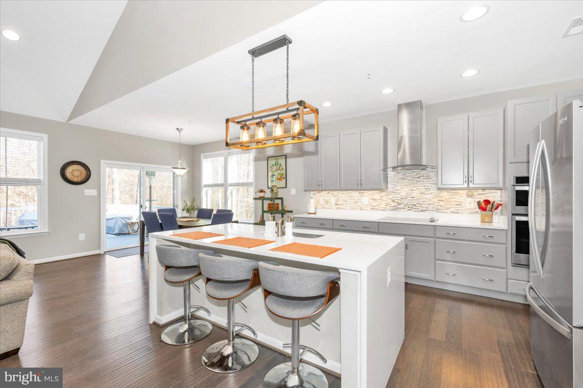 7796 Old Receiver Road Frederick, MD 21702 - Photo 19 of 65 a kitchen with stainless steel appliances kitchen island granite countertop a sink and cabinets