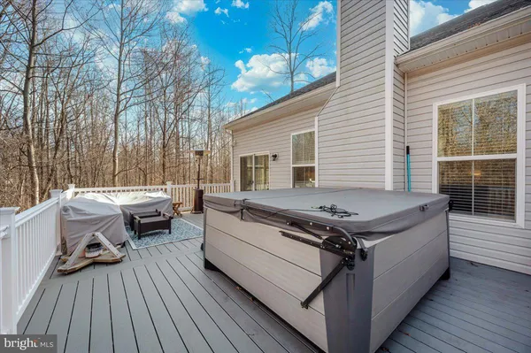 a view of a deck with furniture and wooden floor
