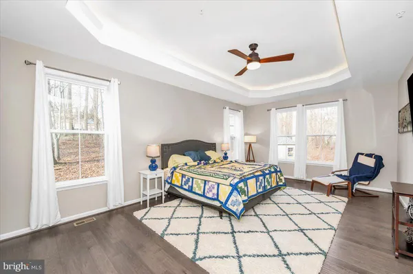 a view of a livingroom with a ceiling fan and window