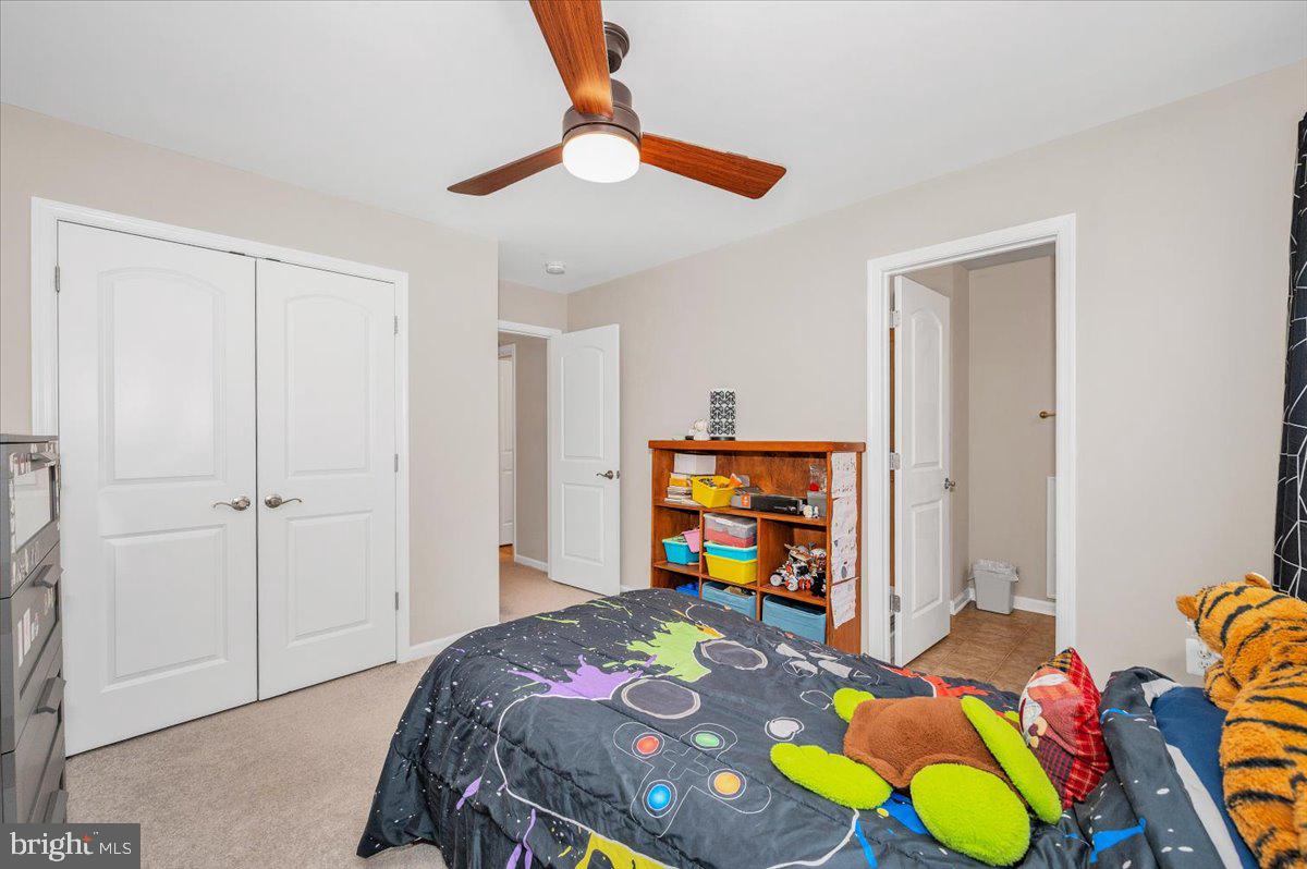 7796 Old Receiver Road Frederick, MD 21702 - Photo 42 of 65 a bedroom with a bed and a television