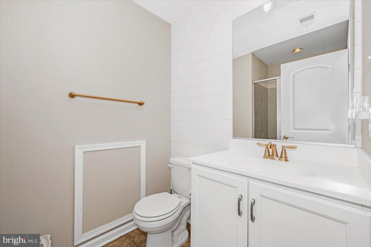 7796 Old Receiver Road Frederick, MD 21702 - Photo 43 of 65 a bathroom with a sink a toilet and a mirror