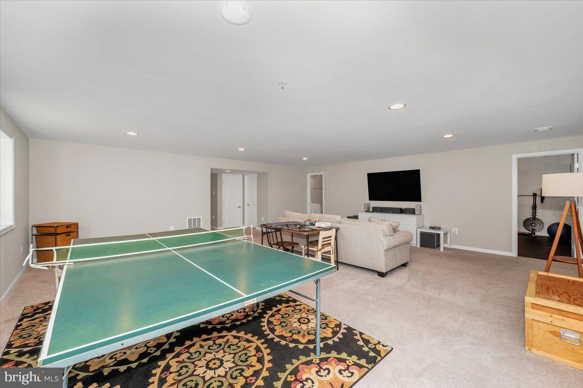 7796 Old Receiver Road Frederick, MD 21702 - Photo 47 of 65 a living room with furniture and a flat screen tv