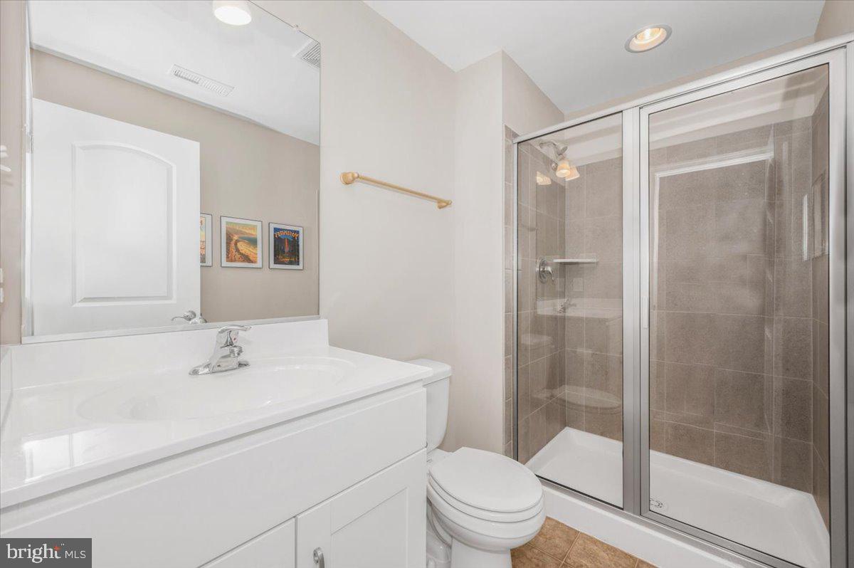 7796 Old Receiver Road Frederick, MD 21702 - Photo 49 of 65 a bathroom with a sink toilet and shower