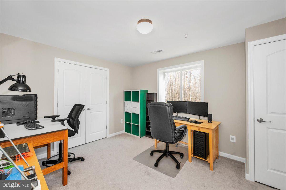7796 Old Receiver Road Frederick, MD 21702 - Photo 50 of 65 a view of a workspace with furniture and a window