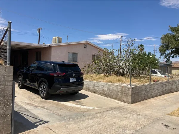 a view of a car in front of a house