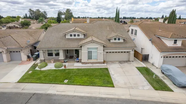 a aerial view of a house with a garden and plants