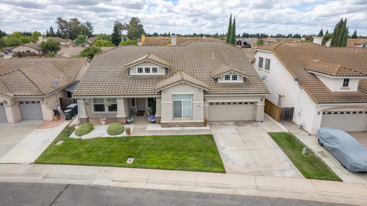 a aerial view of a house with a garden and plants