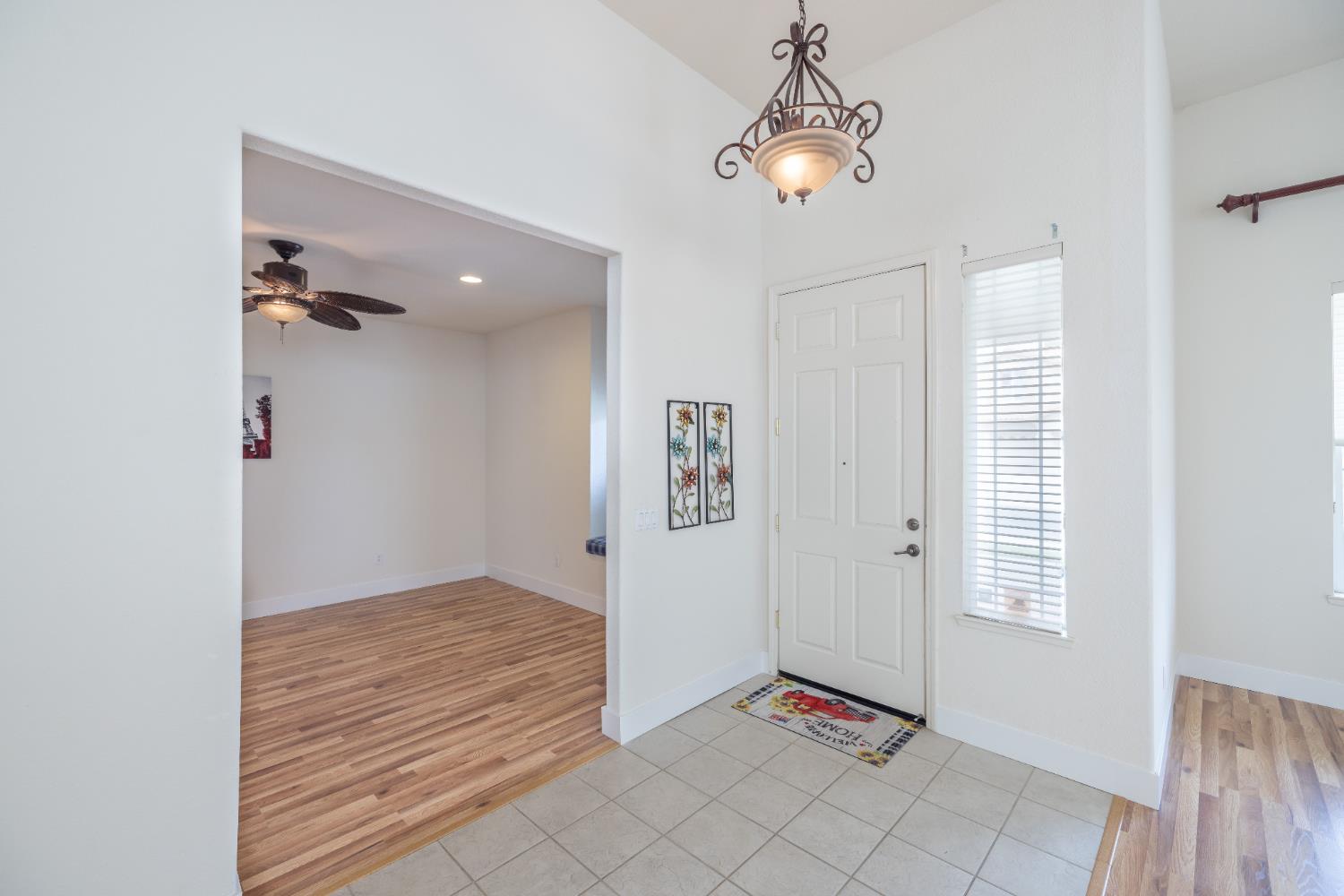 10050 Cameron Pines Way Sacramento, CA 95829 - Photo 13 of 31 wooden floor in an empty room with a window