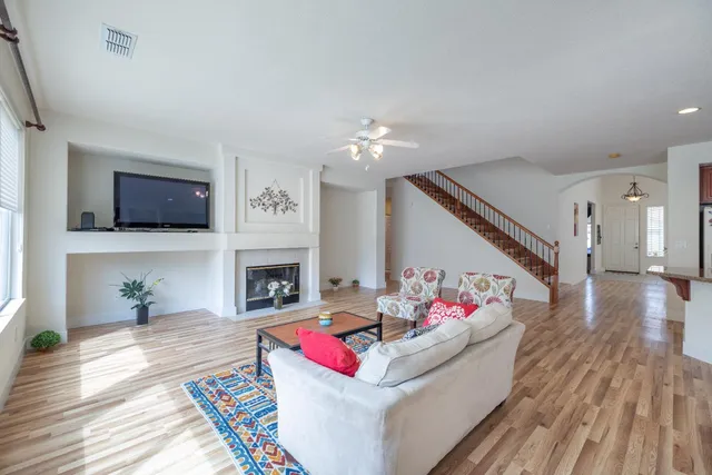 a living room with furniture fireplace and flat screen tv