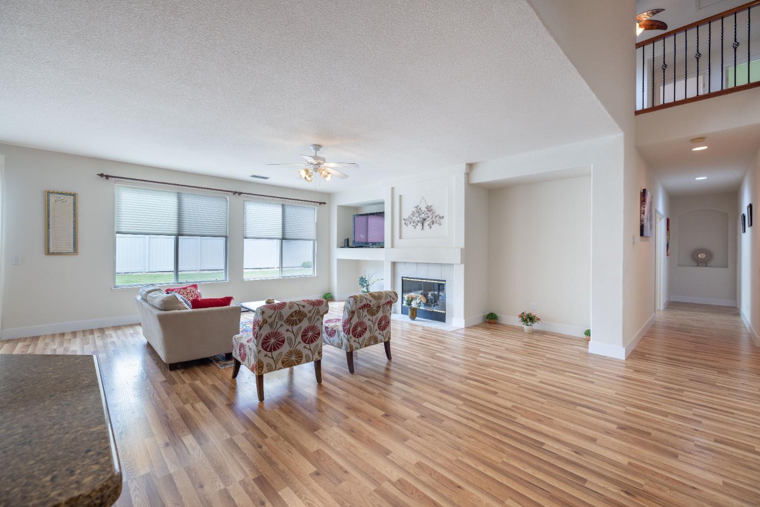 10050 Cameron Pines Way Sacramento, CA 95829 - Photo 15 of 31 a living room with furniture and wooden floor