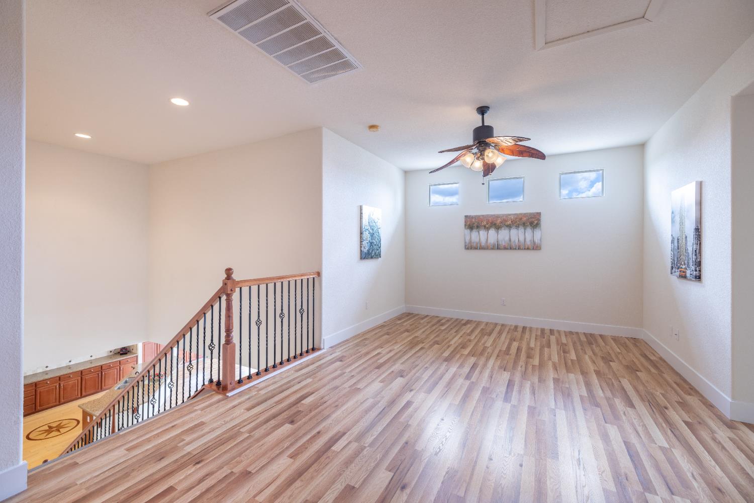10050 Cameron Pines Way Sacramento, CA 95829 - Photo 19 of 31 a view of a hallway with wooden floor