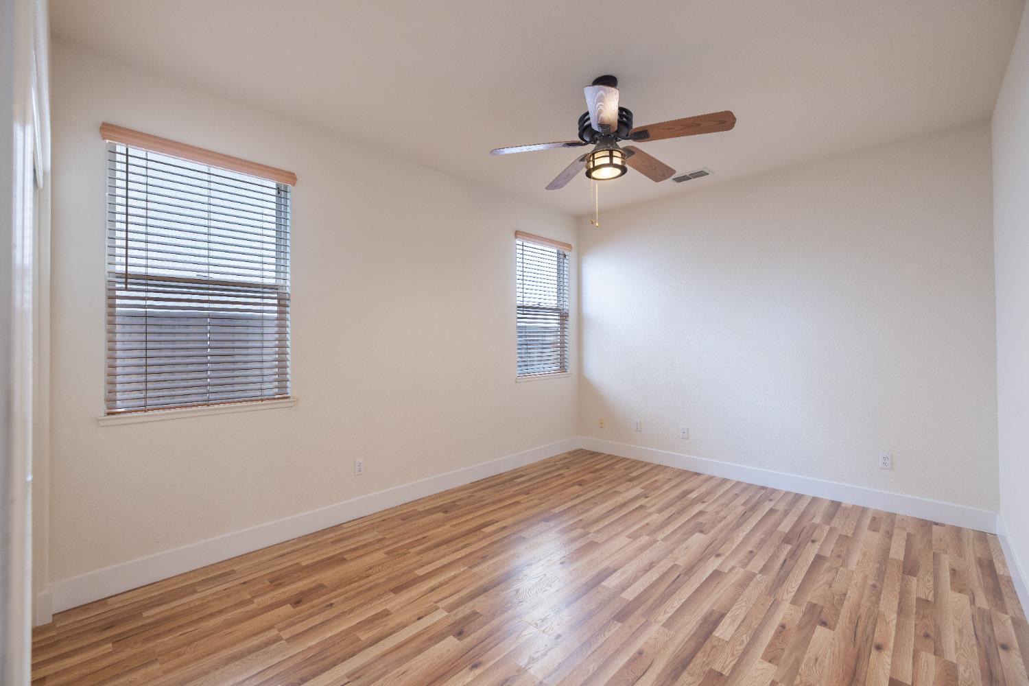 10050 Cameron Pines Way Sacramento, CA 95829 - Photo 23 of 31 wooden floor in an empty room with a window