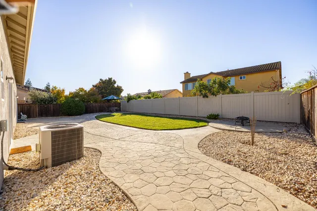 a view of a swimming pool with a yard