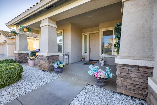 a front view of a house with outdoor seating