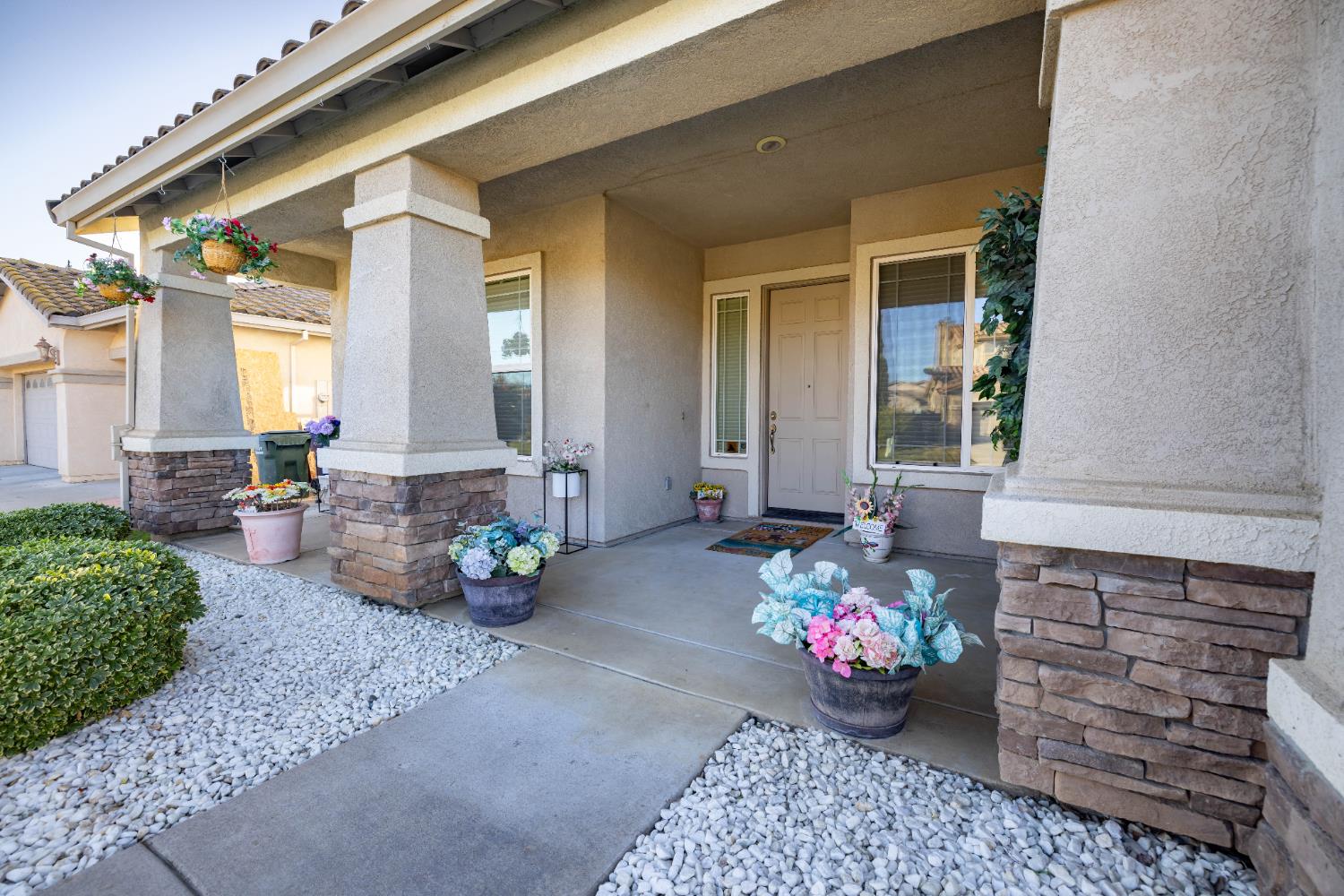 10050 Cameron Pines Way Sacramento, CA 95829 - Photo 4 of 31 a front view of a house with outdoor seating