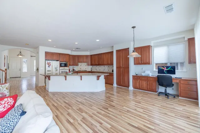 a view of kitchen with cabinets and wooden floor