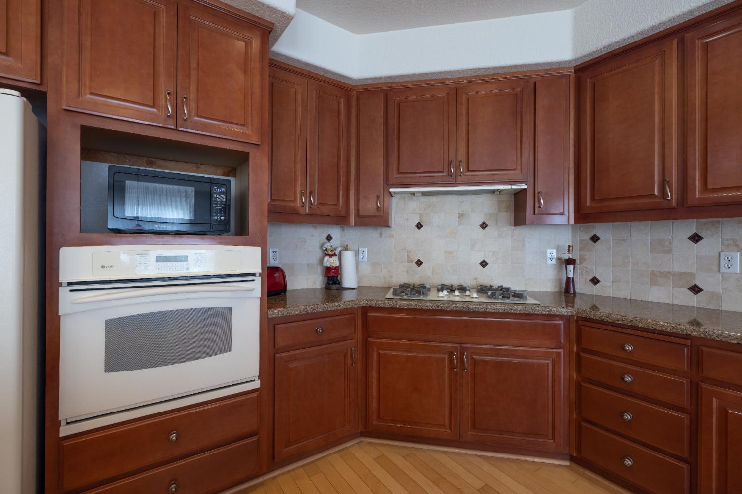 10050 Cameron Pines Way Sacramento, CA 95829 - Photo 8 of 31 a kitchen with granite countertop cabinets stainless steel appliances and a sink
