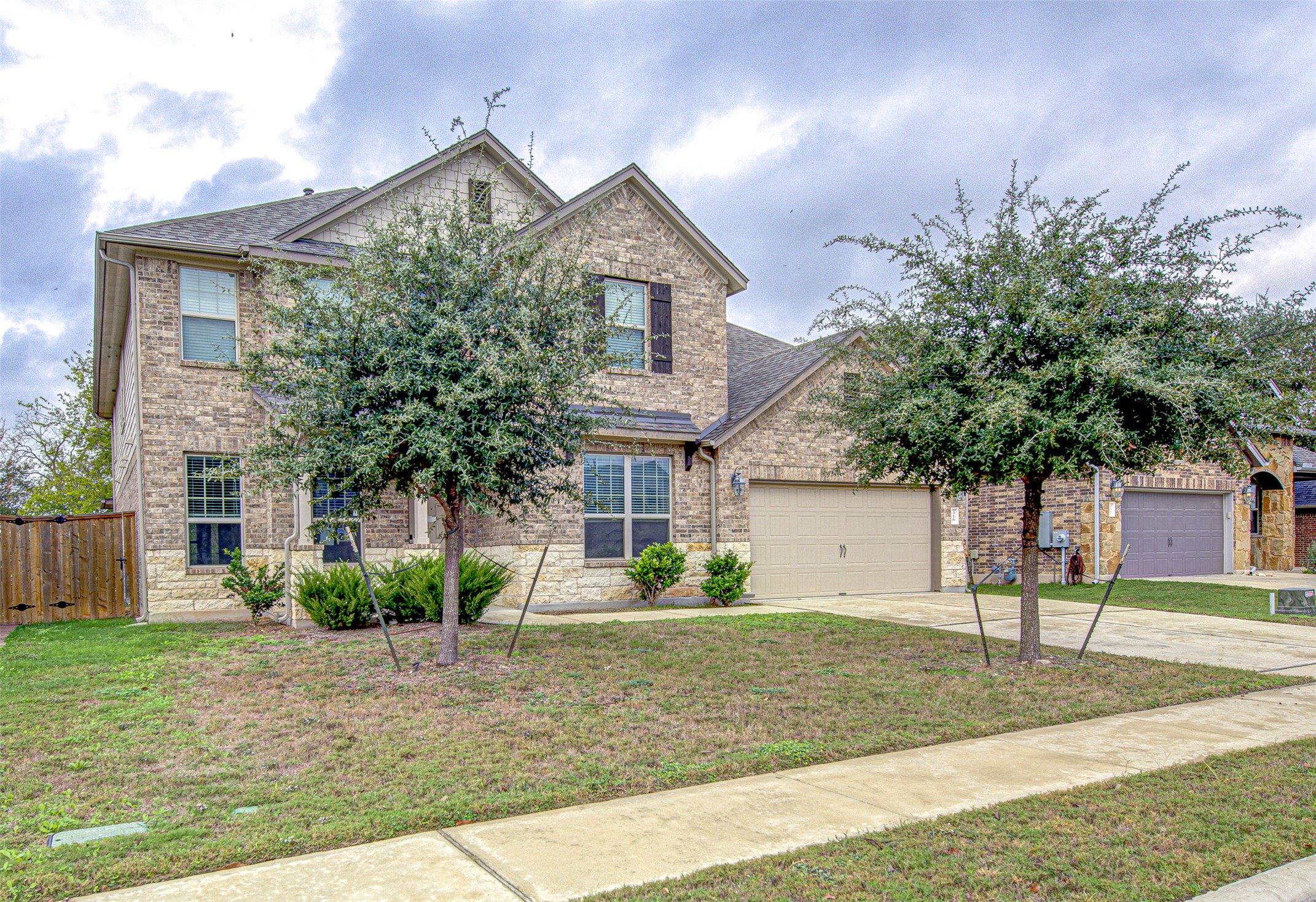 316 Buffalo Ridge Drive Manchaca, TX 78652 - Photo 2 of 37 a front view of a house with garden