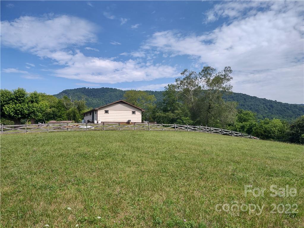 171 Riley Trull Road Canton, NC 28716 - Photo 31 of 31 a view of a big yard with potted plants and mountain view