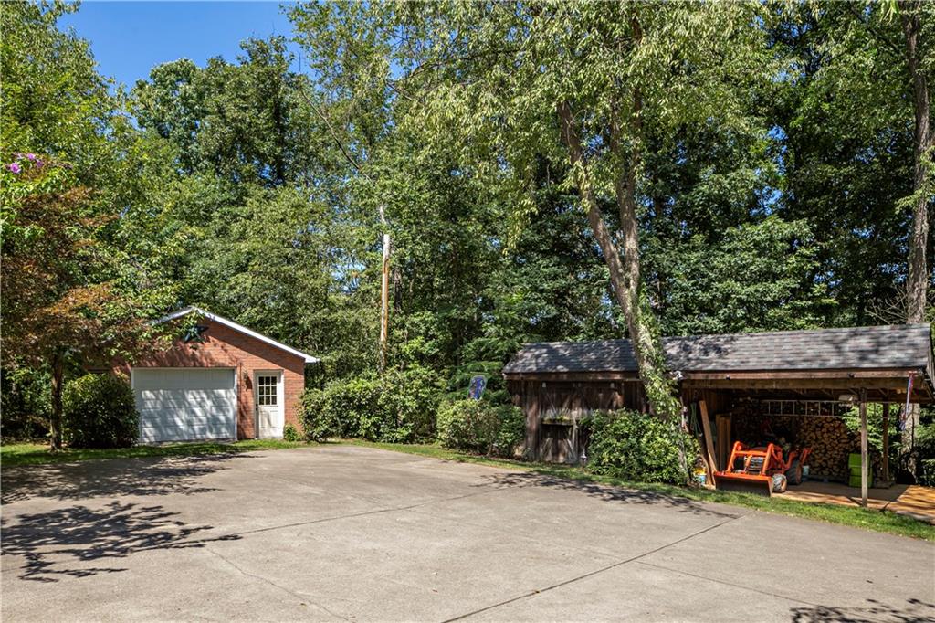 792 Pine Run Road Apollo, PA 15613 - Photo 23 of 25 Carport, detached garage and large shed. To the right of the shed lies the greenhouse