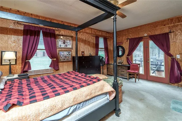 a bedroom with furniture and a window