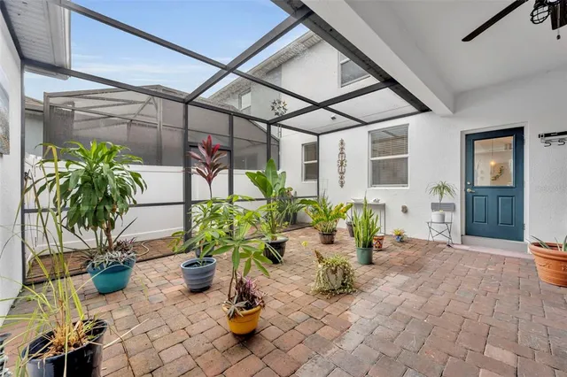 a view of a chairs and table in a patio