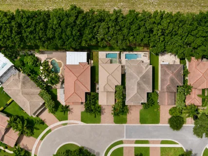 an aerial view of a house with outdoor space
