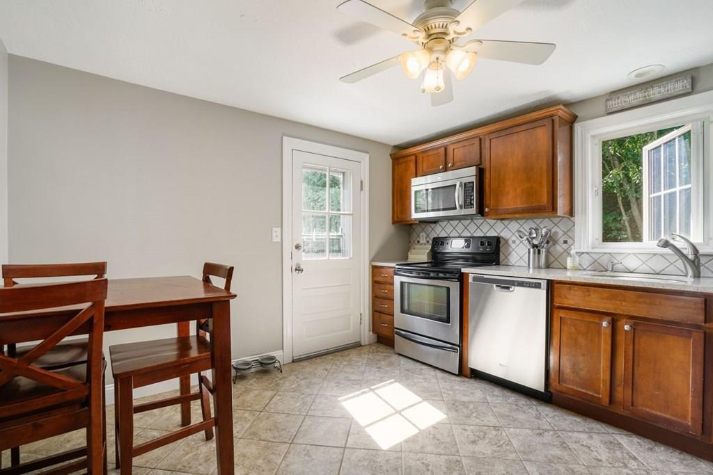 26 Rinaldo Road Weymouth, MA 02191 - Photo 6 of 27 a kitchen with stainless steel appliances granite countertop a stove a sink dishwasher and a refrigerator