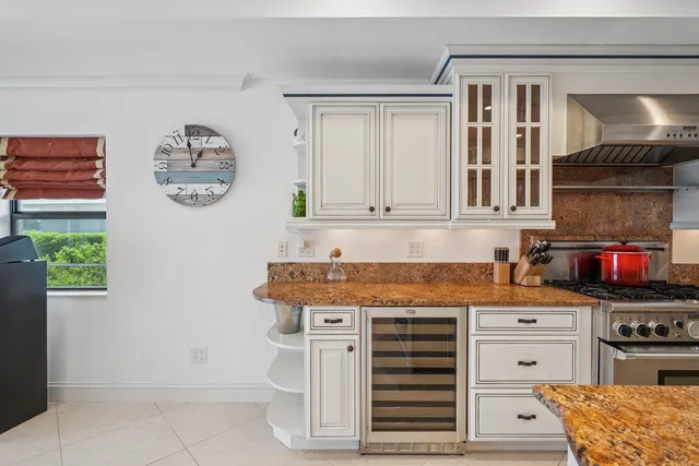 a living room with furniture and large windows