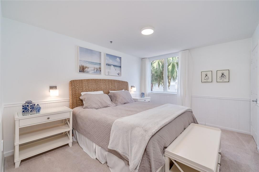217 Hendricks Isle, Unit 402 Fort Lauderdale, FL 33301 - Photo 17 of 39 a bedroom with a bed and a window