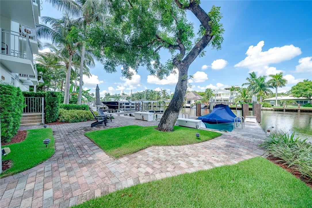 217 Hendricks Isle, Unit 402 Fort Lauderdale, FL 33301 - Photo 21 of 39 a view of a park with plants and a large tree