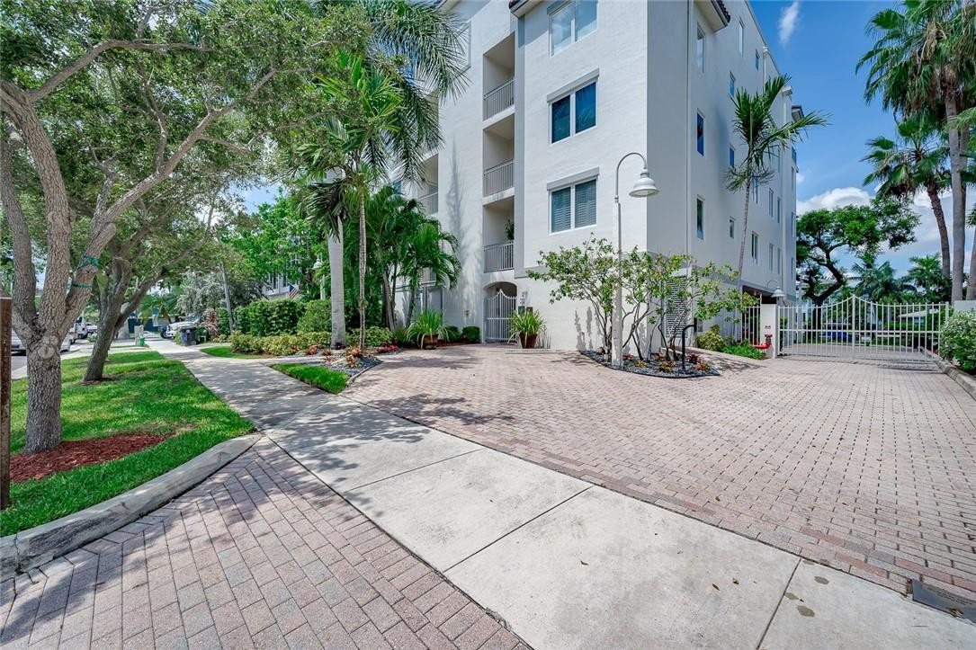 217 Hendricks Isle, Unit 402 Fort Lauderdale, FL 33301 - Photo 23 of 39 a front view of a house with a yard