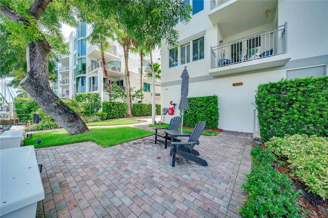 217 Hendricks Isle, Unit 402 Fort Lauderdale, FL 33301 - Photo 25 of 39 a view of a chair and table in the garden front of house
