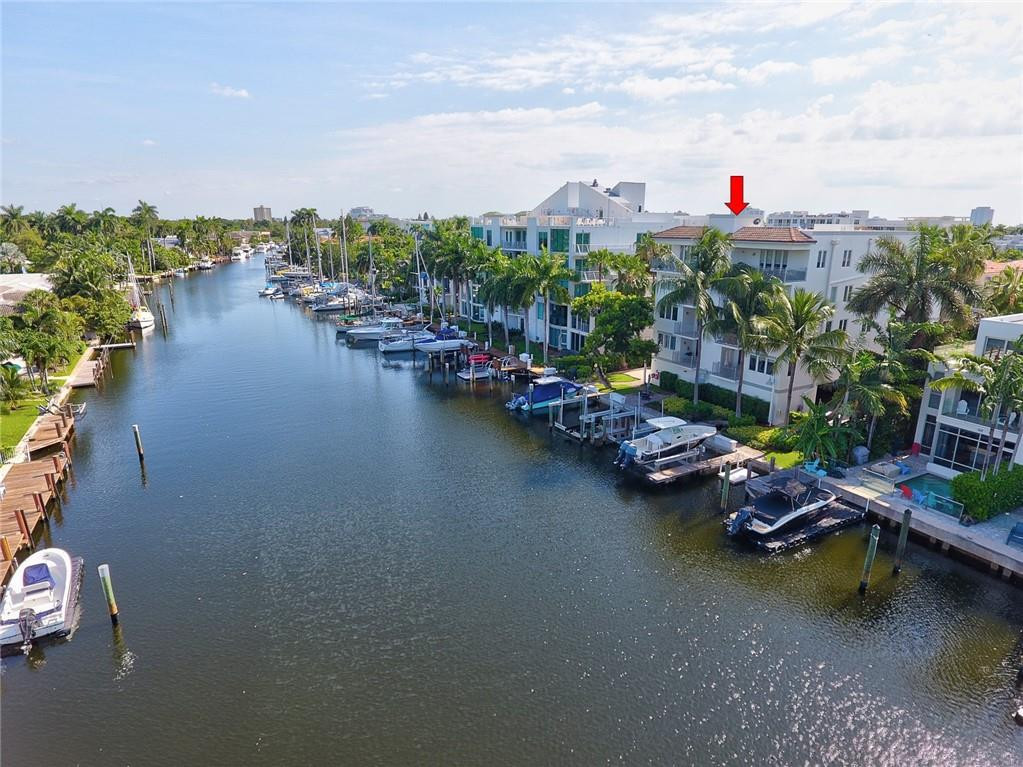 217 Hendricks Isle, Unit 402 Fort Lauderdale, FL 33301 - Photo 30 of 39 an aerial view of a city with lots of residential buildings ocean and mountain view in back