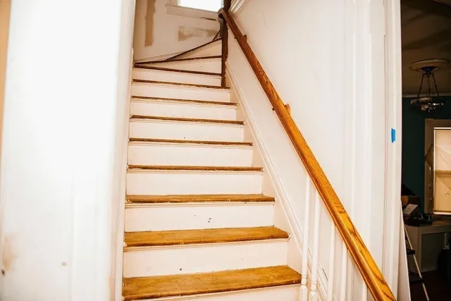 a kitchen with refrigerator and cabinets