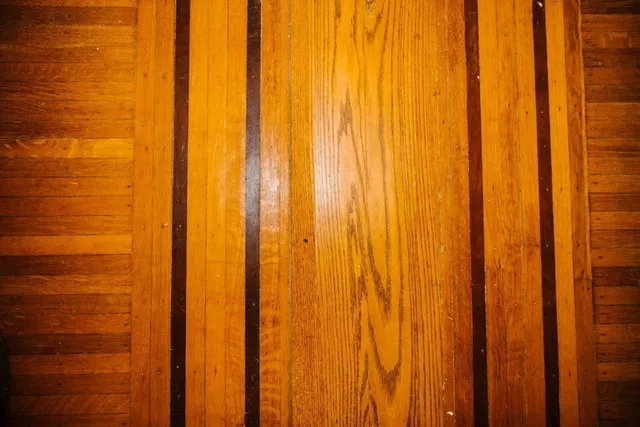 a view of a kitchen with refrigerator and window