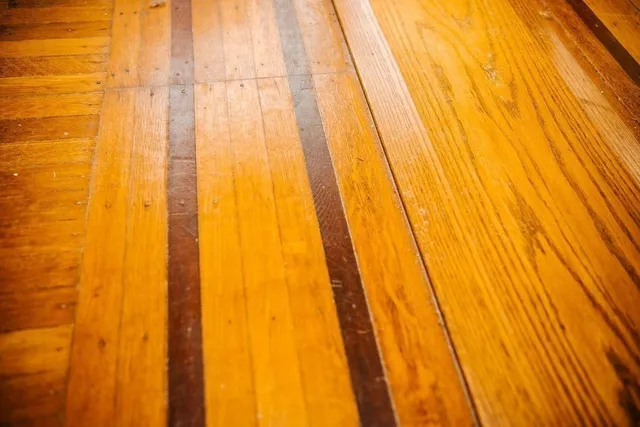 a large bed sitting in a bedroom and a chandelier