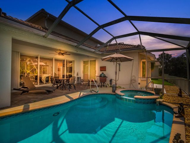 a view of a backyard with sitting area
