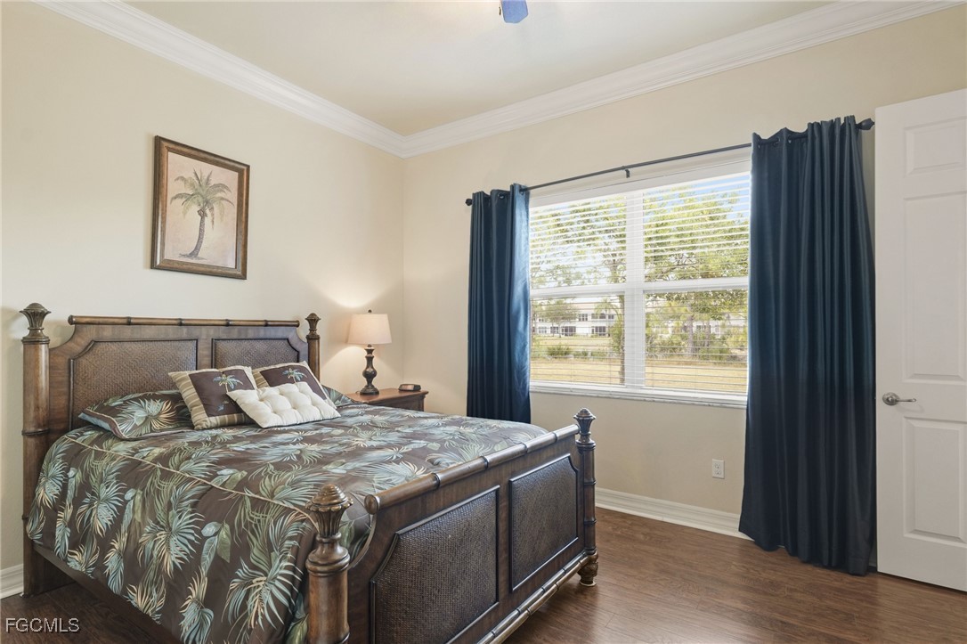 11040 Yellow Poplar Drive Fort Myers, FL 33913 - Photo 11 of 35 a bedroom with a large bed and a window